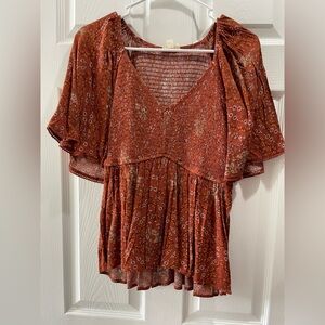 Smocked peplum top